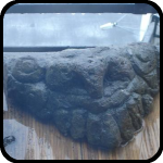 Stone WIth a Face Carved Into It Stone WIth a Face Carved Into It