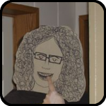 A Cardboard Woman Painting