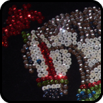 Carnival horse made of sequins on black velvet Carnival horse made of sequins on black velvet