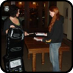 Kimbery and Rosalie trading for a giant cell phone