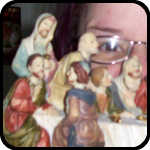 Juli playing peek a boo with the Last Supper Statue